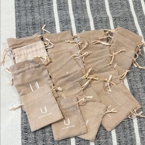 Uncommon James Beige jewelry Drawstring Bags